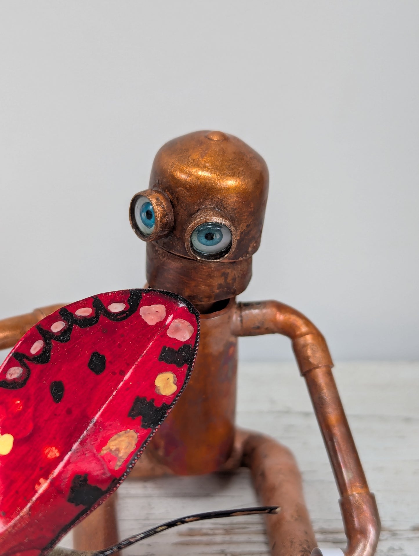 Robot holding a butterfly - Deshca Designs