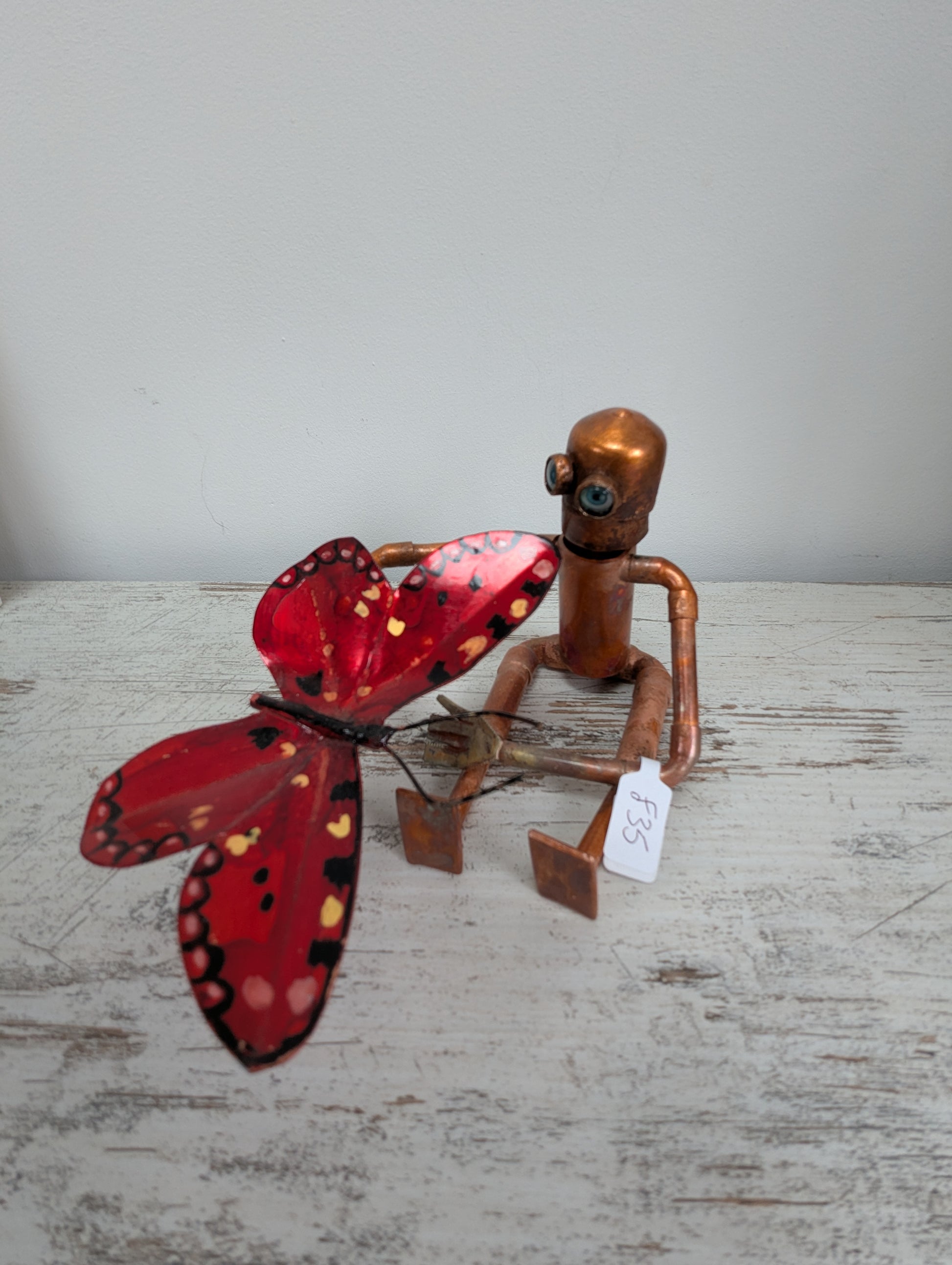 Robot holding a butterfly - Deshca Designs