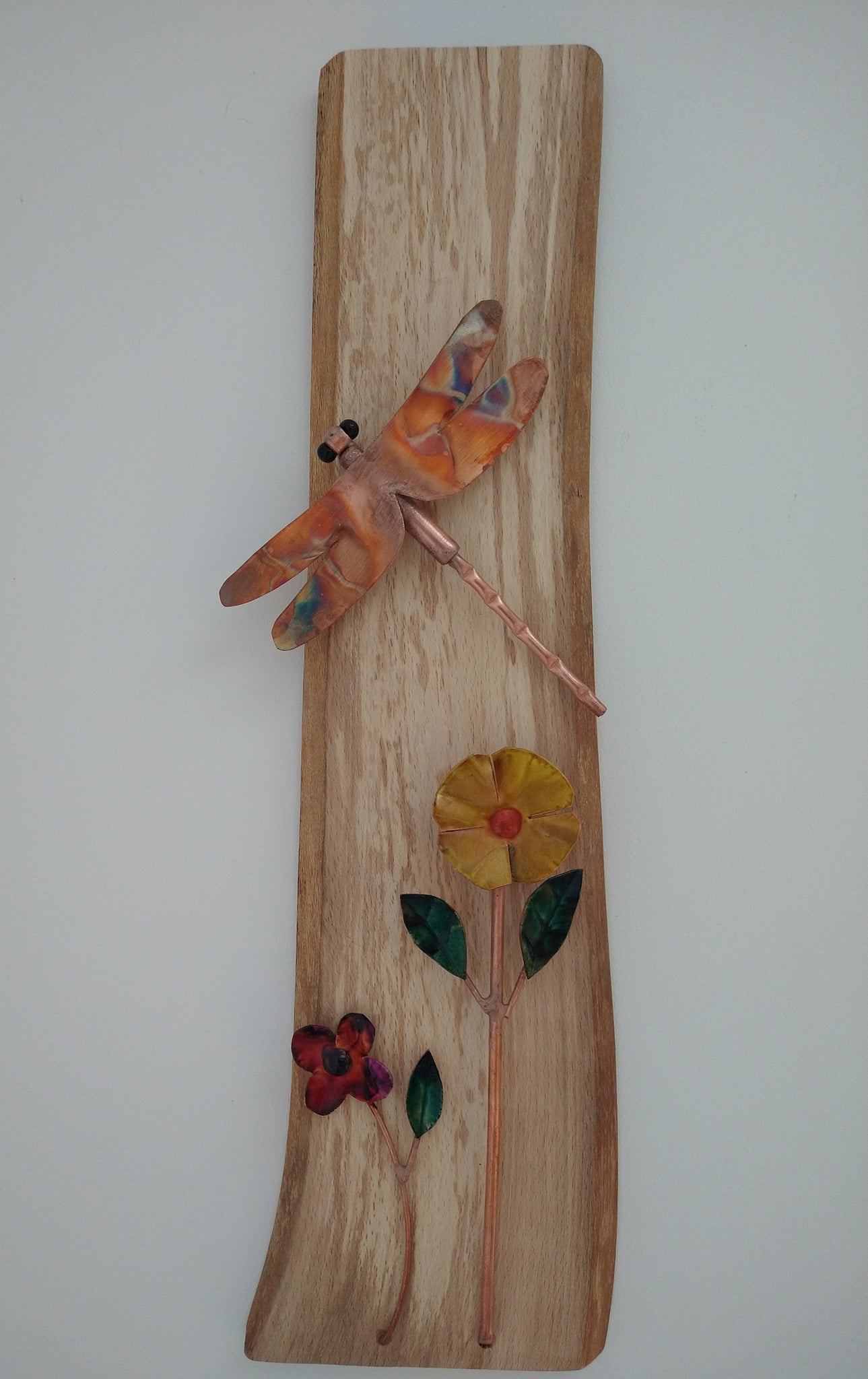 Copper dragonfly and flowers